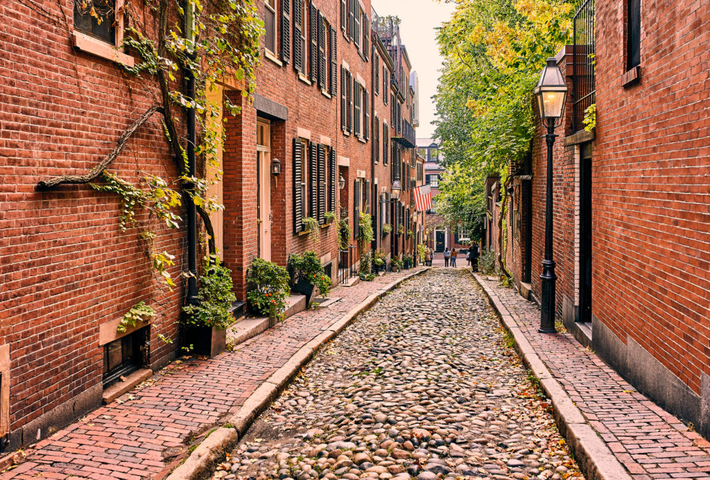Stone lined historic Boston streets with brick sidewalks and brick houses